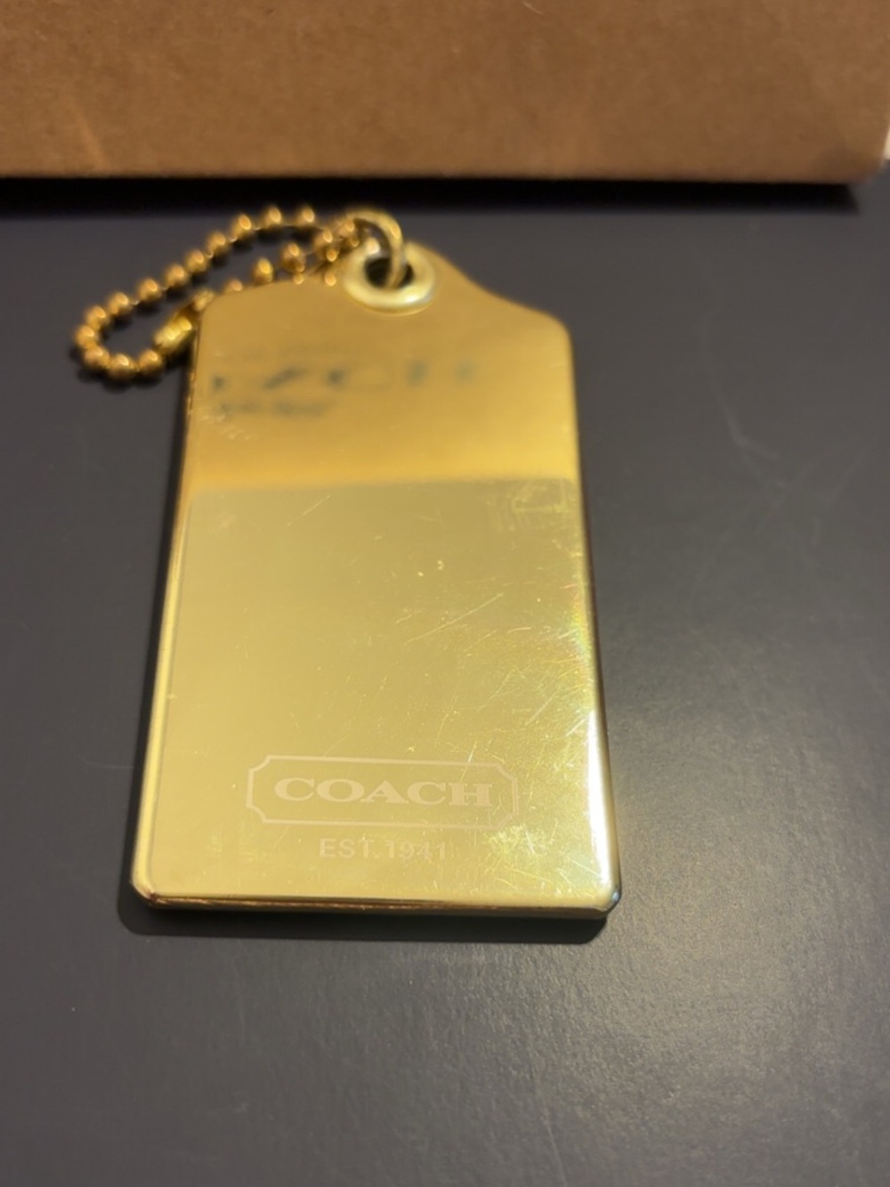Coach large poppy metallic gold-tone hang tag EUC - Picture 7 of 7
